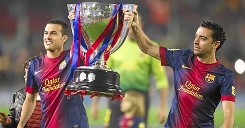 Pedro y Xavi celebrando el título de Liga. Pedro y Xavi celebrando el título de Liga.